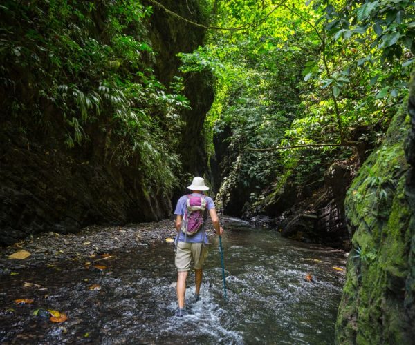 Man in hike in the slot canyon in Colombia, South America