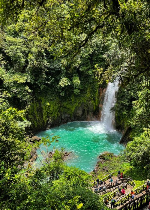 Majestic waterfall in the rainforest jungle of Costa Rica. Tropical hike.